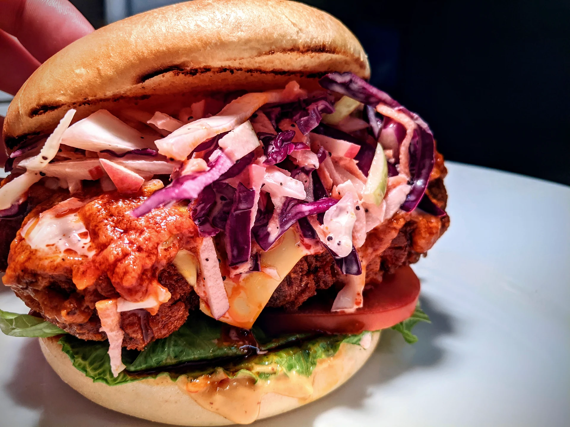 Burger topped with slaw
